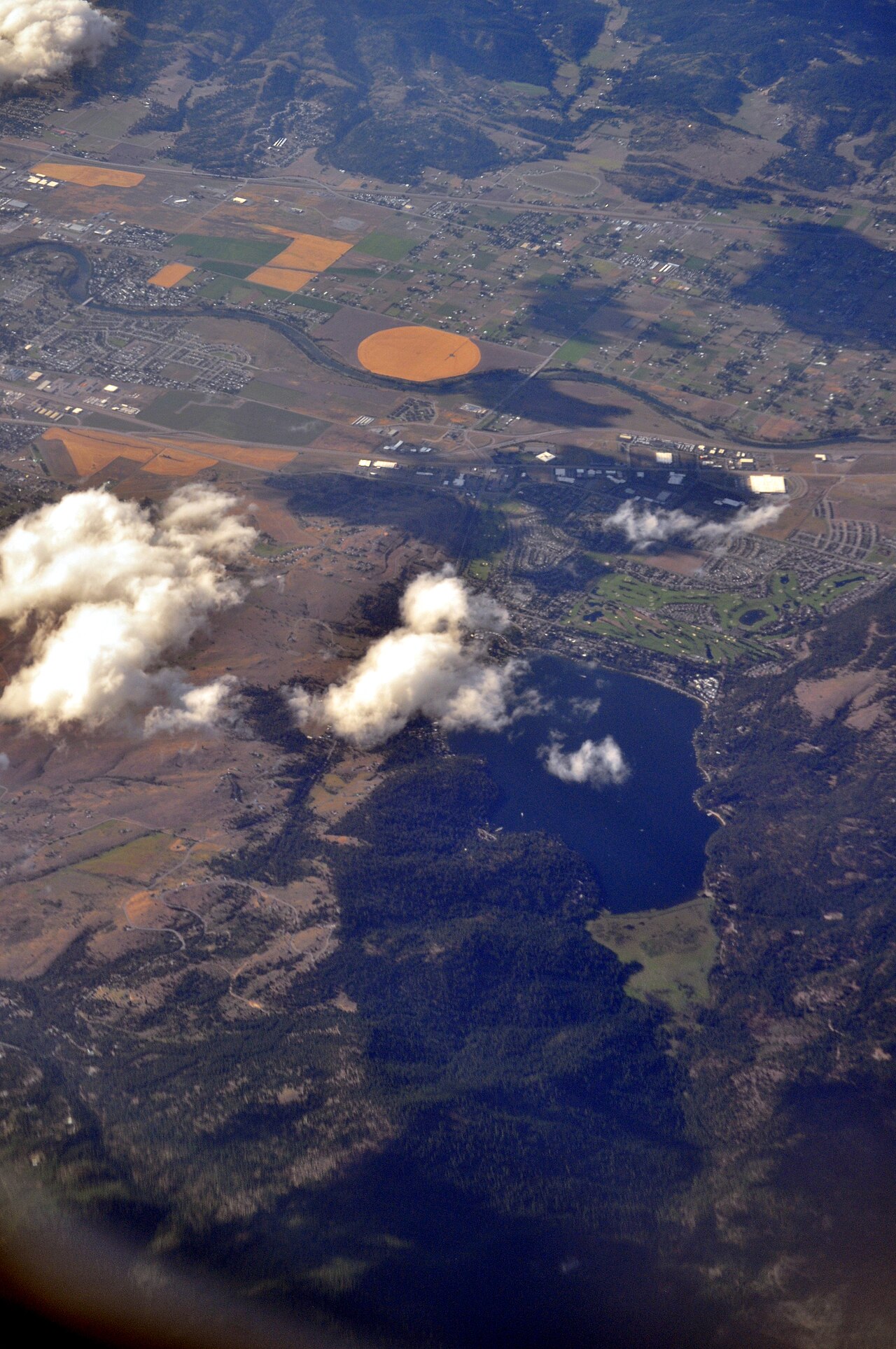 Aerial view over Liberty Lake, Washington, showing the lake and surrounding development.